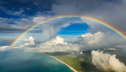 Fotobehang 虹がかかる空、海と陸 © mol