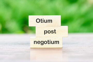 Otium post negotium It is translated from Latin as, Rest after the case written on wooden blocks