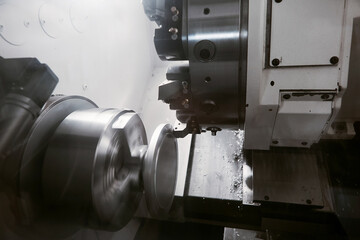 Rotation of aluminium part on CNC metalworking machinery. Working of milling machine with Control...