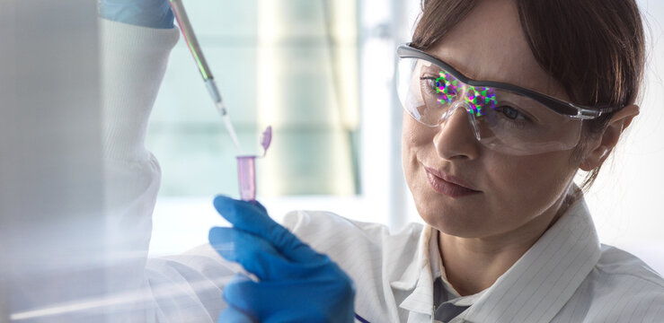 Scientist pipetting chemical formula for research in laboratory