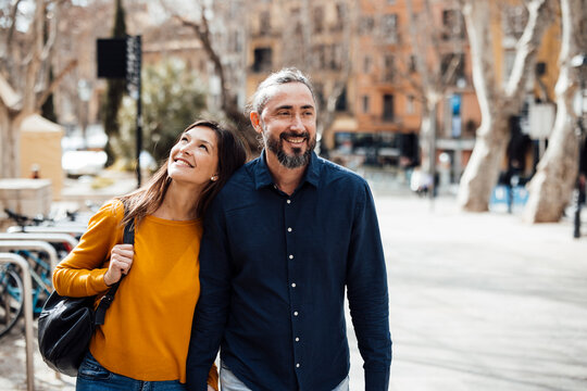 Happy couple having fun together in city