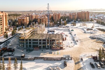 Naklejka premium the construction site of an apartment building in the winter from a height
