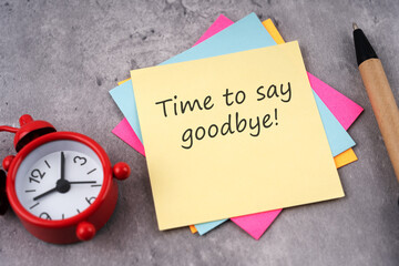 Time to say goodbye text on adhesive note