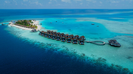 The Tropical aerial view with maldives paradise scenery seascape with water villas as amazing sea and lagoon beach, Exotic tourism