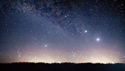 A glittering night sky, illuminated by a million tiny stars and illuminated by a soft, ethereal glow