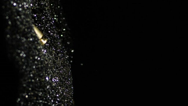 Vertical View Of 9mm Parabellum Cartridges Fall And Sink Into The Gun Powder. - close up shot