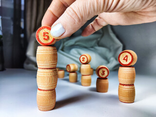 Small wooden barrels with numbers built in columns. The concept of duration and ways to achieve the...