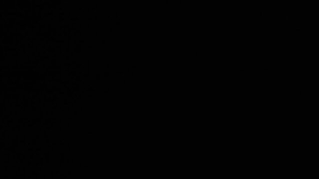 9mm parabellum bullets falling in slow motion against black background, macro