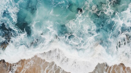 Fototapeta premium Summer seascape, beautiful waves, blue sea water on a sunny day. View from above. Beautiful bright splashes of sea waves on the beach sand.