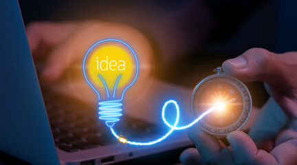 Businessman shows navigation compass and light bulbs with the word idea. Concept of thinking and...