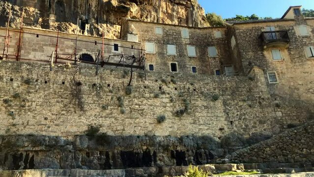 Monastery built into the side of a mountain. Pustinja Blaca Monastery. Blaca Hermitage. Religion. Brac Island, Croatia. Europe.