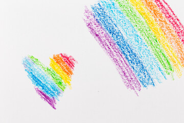 Wax crayon hand drawing heart rainbow background