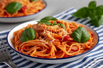 Homemade Pasta Pomodoro on a Plate, side view.