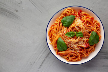 Homemade Pasta Pomodoro on a Plate, top view. Flat lay, overhead, from above. Copy space.