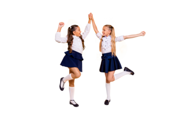 Back to school concept. Full length, legs, body, size portrait of beautiful, charming, gorgeous, adorable, good-looking small girls hold hands looking at each other isolated on yellow background