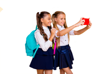 Profile side view photo of two charming, gorgeous, adorable, good-looking small girls make selfie on smartphone camera isolated on shine yellow background