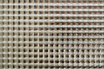 Gray glass background with small squares