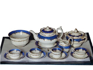 Vintage porcelain tea set on tray