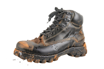 old brown leather rugged worker boots shoes with mud and dust isolated on white or transparent png
