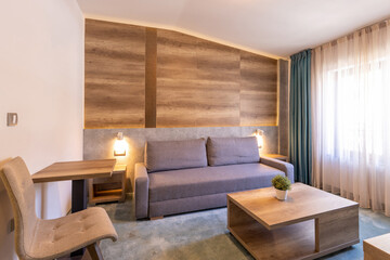 Interior of a modern hotel apartment with wooden wall