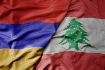 big waving national colorful flag of lebanon and national flag of armenia .