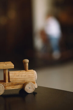 Close up picture of wooden toy train on home  background. Copy space for text
