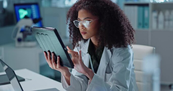 Scientist, woman and tablet for laboratory research, DNA analysis and results in medical study at night. Young science expert or African person in biotechnology, scroll or reading on digital software