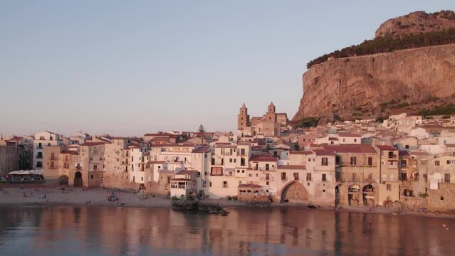 Aerial view of Cefalu medieval city during summer at sunset, Sicily, Italy