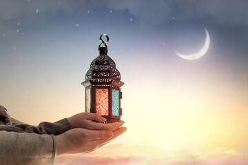 Ornamental Arabic lantern with burning candle