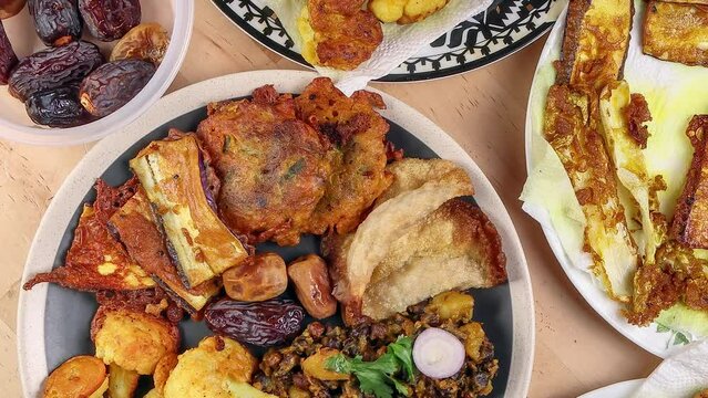 Bengali stye variety fitter deep fried tanpura piaju pakoda battered cauliflower eggplant dumplings chola dal fry dates for iftar Muslim Ramadan breakfast snack comfort food