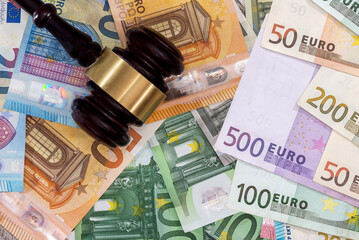 Judge's gavel on Eu paper Euro banknotes. Corruption and bribery concept