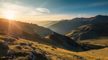 Fotobehang A serene, high definition landscape photo of a mountain range at sunrise. The image should highlight the soft, warm glow of the sun casting long shadows across the rugged terrain. © Exnoi