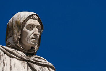 Girolamo (Jerome) Savonarola, an Italian Dominican friar from Ferrara and preacher active in Renaissance Florence. A marble statue completed in 1875 (with blue sky and copy space)