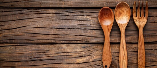 Close up traditional wooden spoon and fork on wooden table. Generated AI image