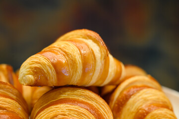 Homemade mini croissants on white plate in buffet line. Fresh Baked Buttery Croissants.