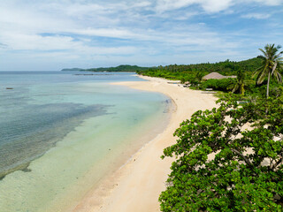 Transparent water and waves on white sand beach in Santa Fe, Tablas, Romblon. Philippines.