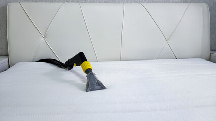 The concept of cleaning and housekeeping. Dry cleaning of the mattress by a professional method.