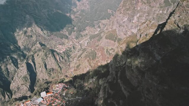 Drone panning to the left towards the town of Curral das Freiras, Madeira