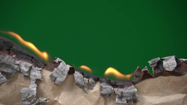 Old craft paper burns leaving a green background, chromakey. The paper burns with a bright flame. The brown leaf burns leaving a green color.