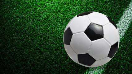 black and white football on Green grass background design 