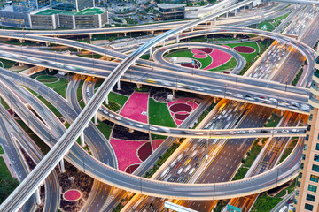 Dubai crossroads of Sheikh Zayed Road highway interchange traffic near Burj Khalifa with metro - 745784518