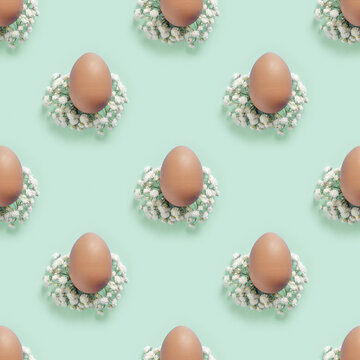 Pastel Easter Eggs minimal pattern with white Flowers on mint, top view brown chicken egg on turquoise color. Easter celebration concept. Festive food, still life holiday, aesthetic  seamless