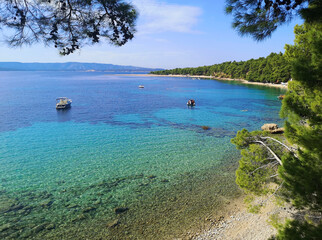 A pebble beach in Bol, Crotia on the island of Brac. Lovely sunlight