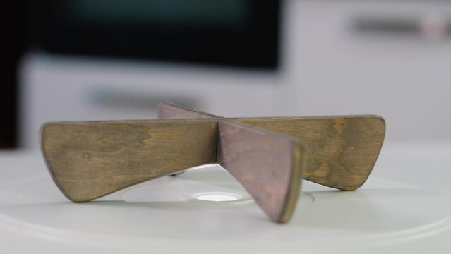 Handmade craft wooden stand under the hot dish on a kitchen background. Rustic kitchenware