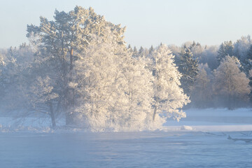 River landscape with frost and snow in a cold morning. Farnebofjarden national park in north of Sweden. - 745790349