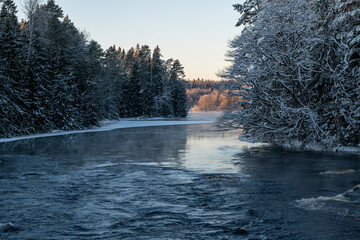 River landscape with frost and snow in a cold morning. Farnebofjarden national park in north of Sweden. - 745790356