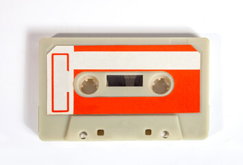 Close up of a blank vintage audio tape cassette isolated on white background