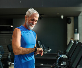gym sport fitness exercising training mature man running watch smart time smartwatch wristwatch...