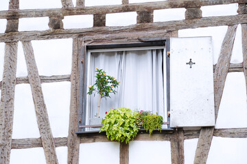 Detail of a window of a traditional half timbered house located in Colmar, France