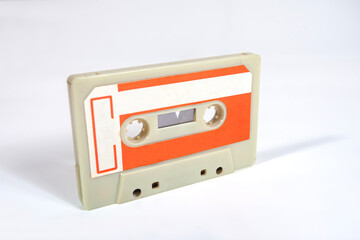 Close up of a blank vintage audio tape cassette isolated on white background